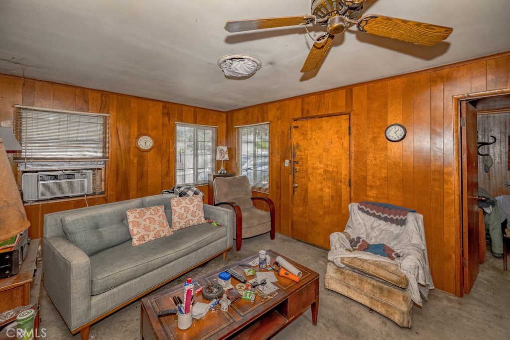 10621 Helendale Avenue Tujunga, CA 91042 - Photo 5 of 20 a living room with furniture and a rug