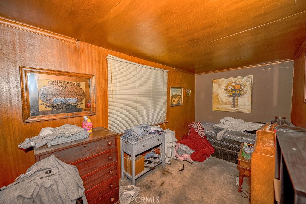 10621 Helendale Avenue Tujunga, CA 91042 - Photo 7 of 20 a bedroom with a bed and wooden floor