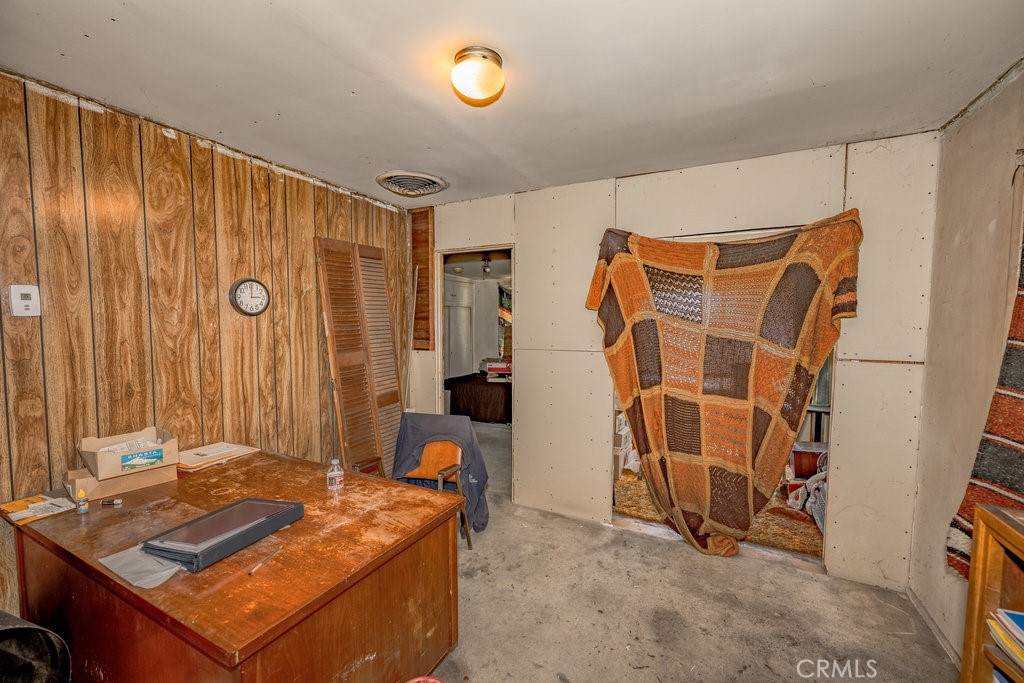 10621 Helendale Avenue Tujunga, CA 91042 - Photo 9 of 20 a blue bed sitting in a room next to a window