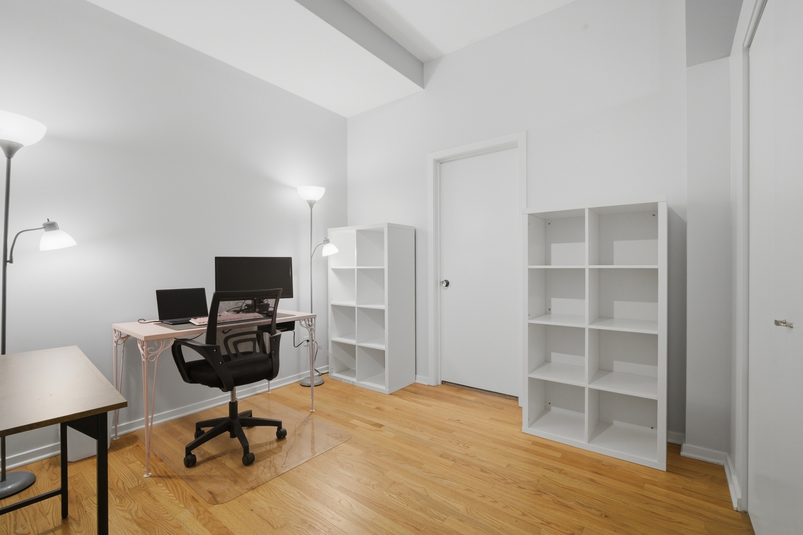 208 West Washington Street, Unit 910 Chicago, IL 60606 - Photo 15 of 18 a view of a workspace with furniture and a window
