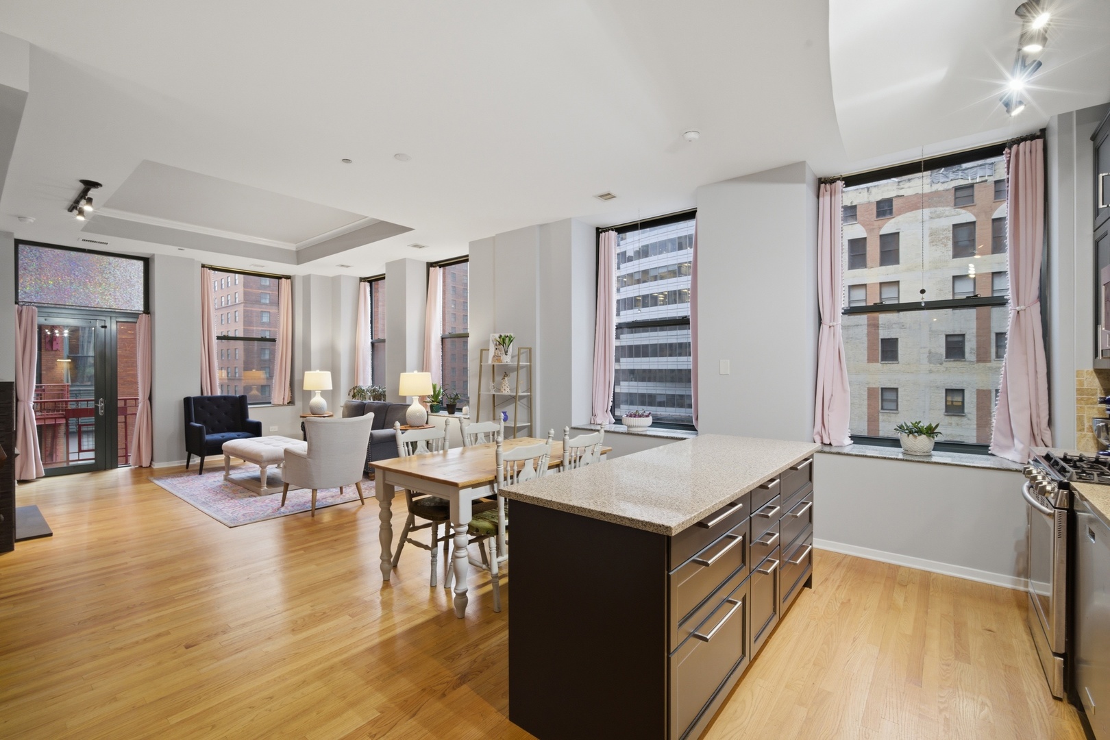 208 West Washington Street, Unit 910 Chicago, IL 60606 - Photo 5 of 18 a room with a large window table and chairs