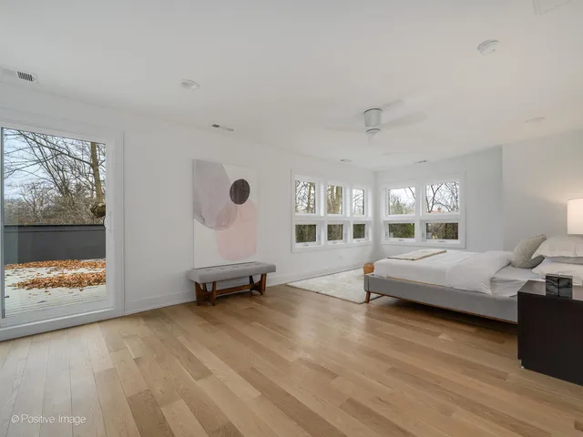 a bedroom with furniture and windows