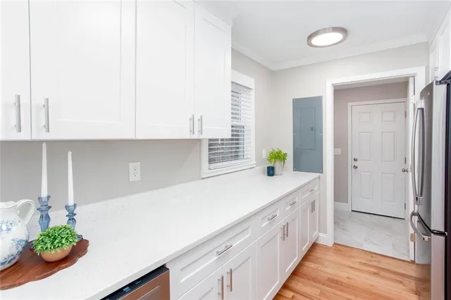 a kitchen with a sink and cabinets