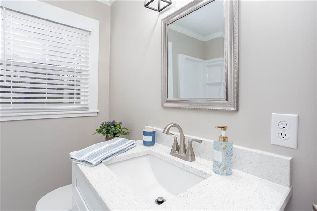 3831 Dillard Street Powder Springs, GA 30127 - Photo 15 of 30 a bathroom with a sink and a toilet