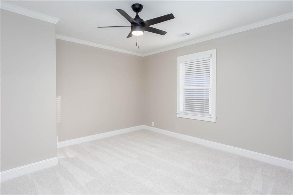 3831 Dillard Street Powder Springs, GA 30127 - Photo 19 of 30 an empty room with a window and a fan