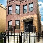a view of a brick building with many windows