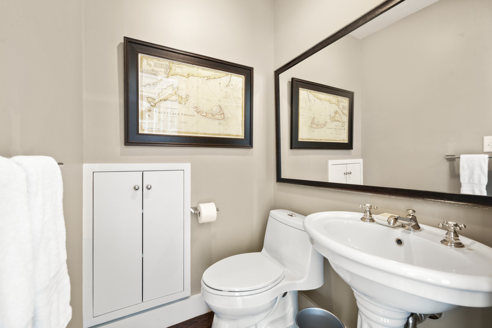 21 Quidnet Road Nantucket, MA 02554 - Photo 41 of 62 a bathroom with a toilet sink and mirror