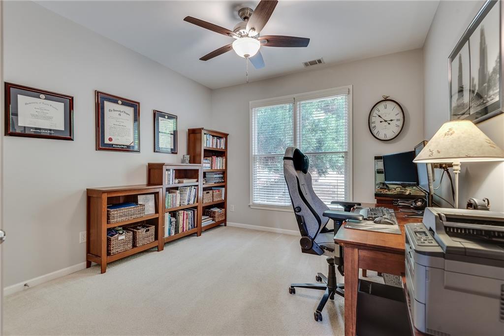 3315 Thimbleberry Trail Dacula, GA 30019 - Photo 11 of 59 a view of a workspace with furniture and a window
