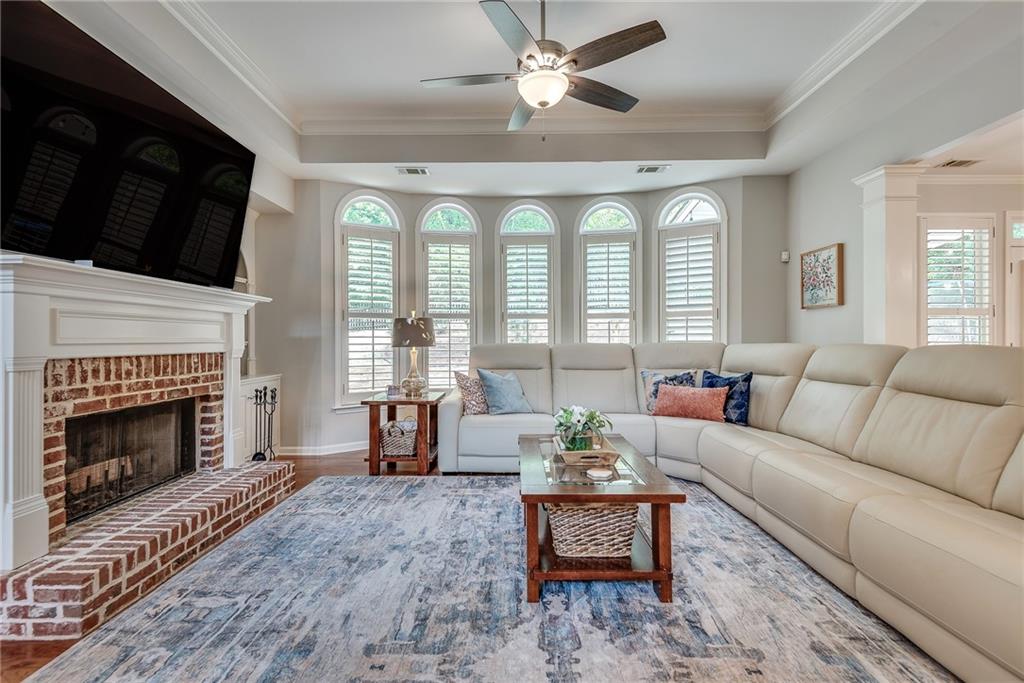 3315 Thimbleberry Trail Dacula, GA 30019 - Photo 13 of 59 a living room with furniture fireplace and window