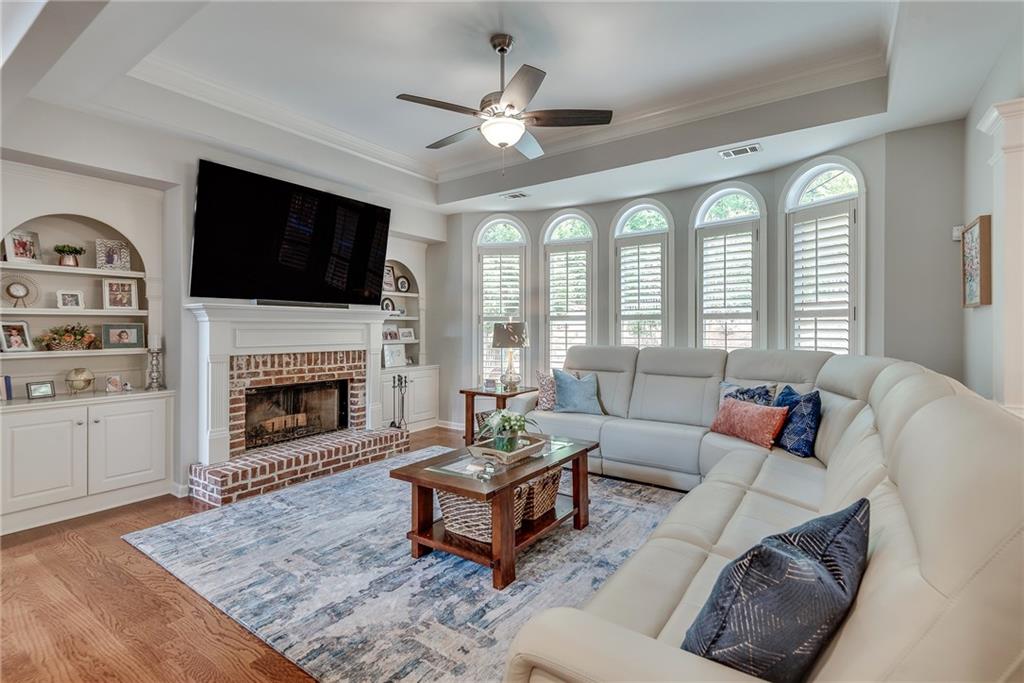 3315 Thimbleberry Trail Dacula, GA 30019 - Photo 14 of 59 a living room with furniture fireplace and flat screen tv