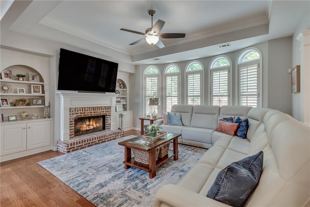 3315 Thimbleberry Trail Dacula, GA 30019 - Photo 15 of 59 a living room with furniture fireplace and a flat screen tv