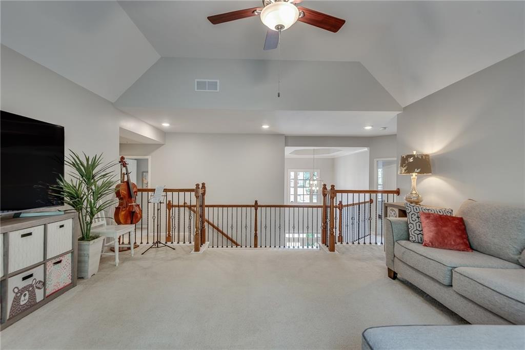 3315 Thimbleberry Trail Dacula, GA 30019 - Photo 29 of 59 a living room with furniture and a flat screen tv