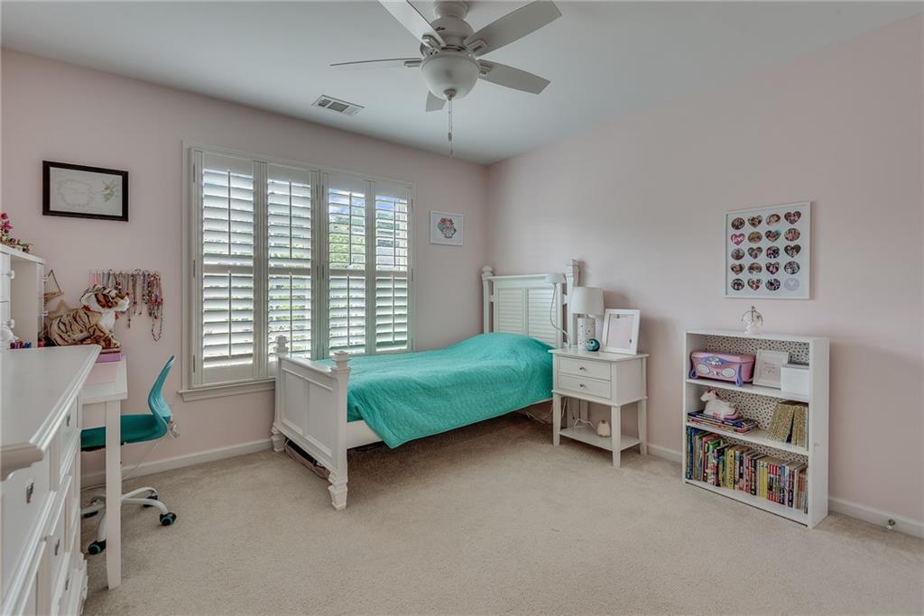 3315 Thimbleberry Trail Dacula, GA 30019 - Photo 30 of 59 a bedroom with furniture and a window