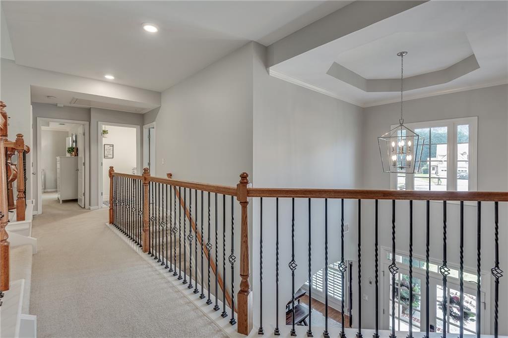 3315 Thimbleberry Trail Dacula, GA 30019 - Photo 34 of 59 a view of a hallway with wooden floor and entryway