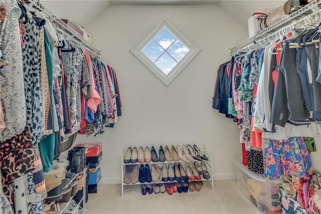 3315 Thimbleberry Trail Dacula, GA 30019 - Photo 45 of 59 a view of walk in closet with clothes