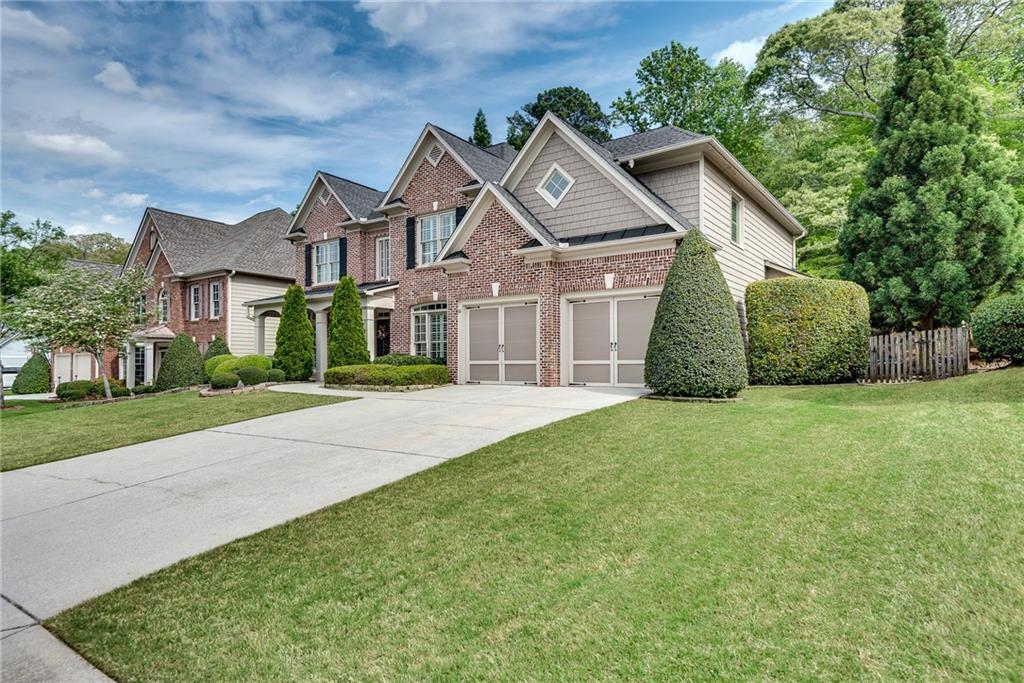3315 Thimbleberry Trail Dacula, GA 30019 - Photo 55 of 59 front view of a house with a yard