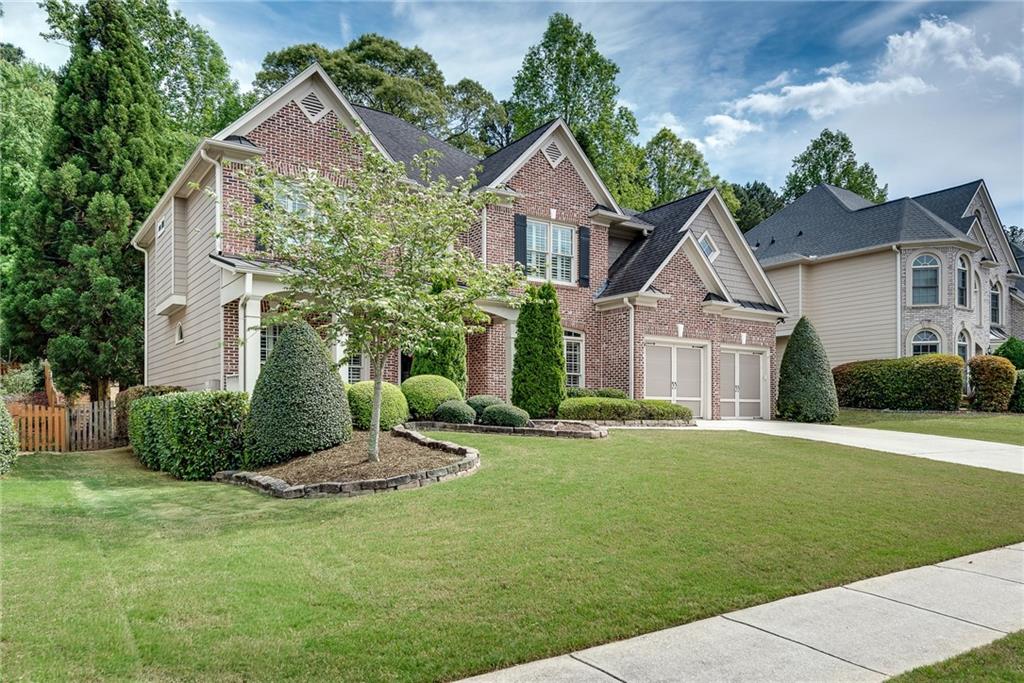 3315 Thimbleberry Trail Dacula, GA 30019 - Photo 56 of 59 a front view of a house with a yard