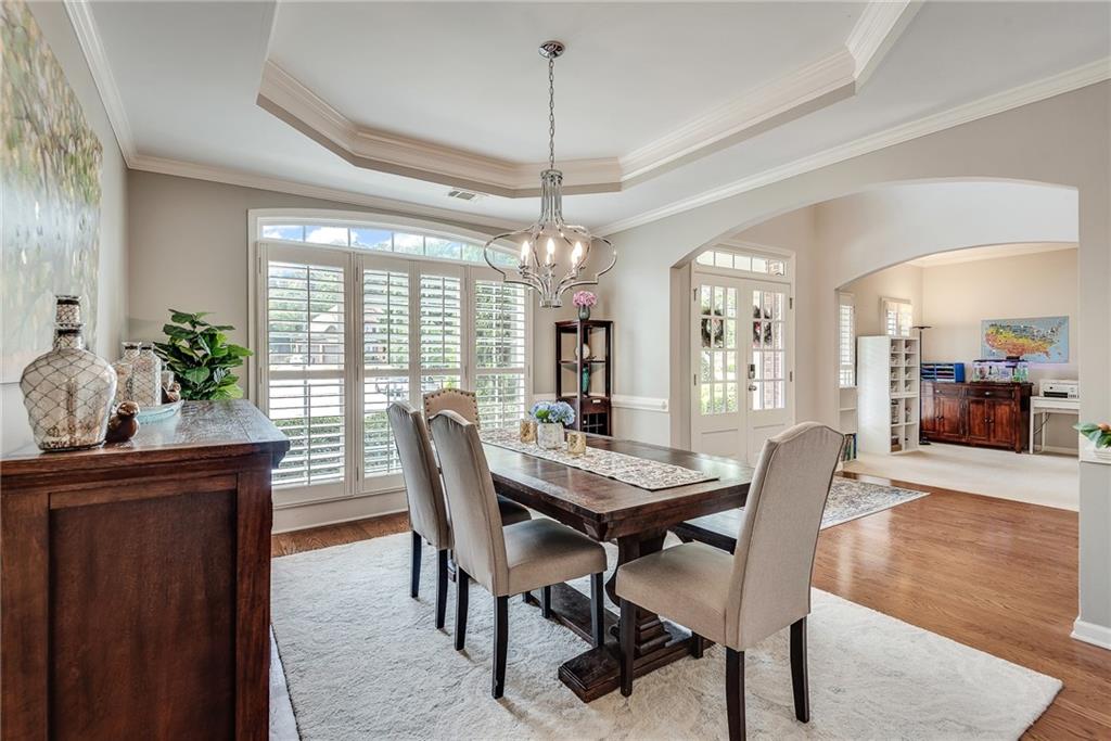 3315 Thimbleberry Trail Dacula, GA 30019 - Photo 8 of 59 a view of a dining room with furniture window and wooden floor