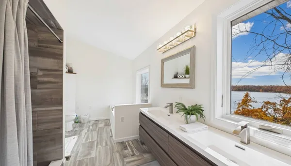 a spacious bedroom with a bed and a window