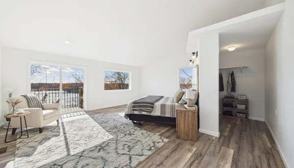 a view of staircase with railing and white walls