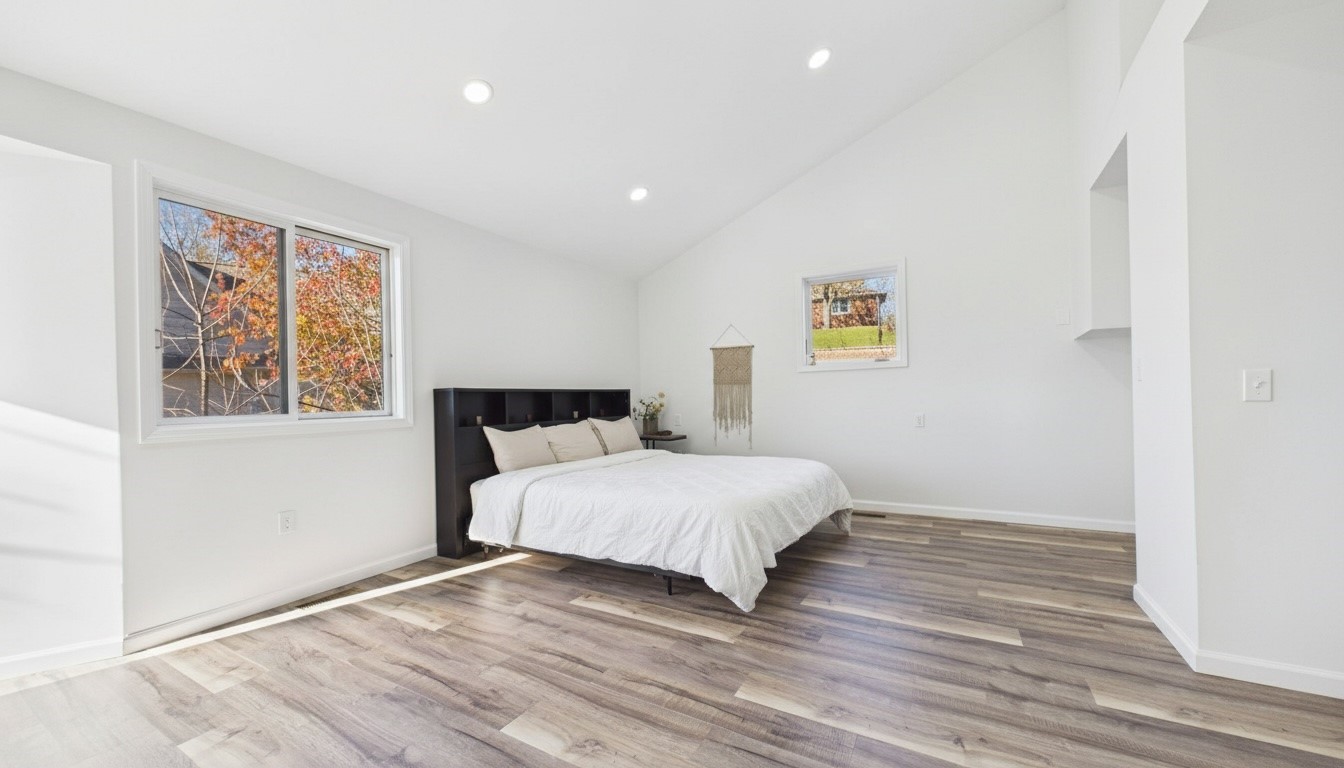 346 Deer Run Road Eddyville, KY 42038 - Photo 24 of 76 a spacious bedroom with a bed and a window