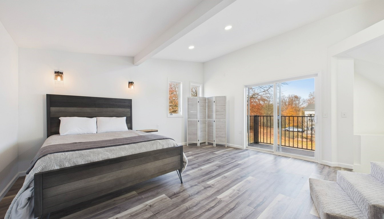 346 Deer Run Road Eddyville, KY 42038 - Photo 28 of 76 a spacious bedroom with a large bed and a large window