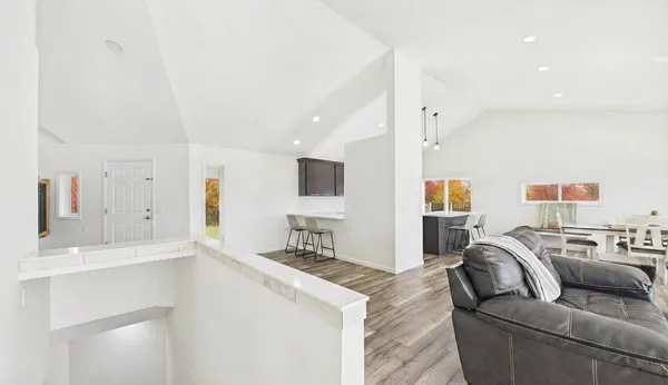 an aerial view of a house with a yard basket ball court and outdoor seating