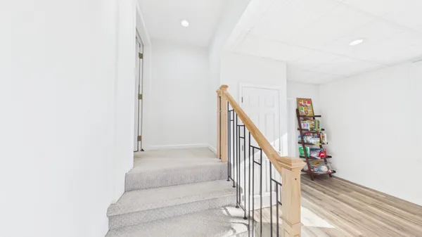 an aerial view of a house with a yard and lake view