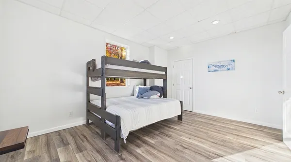 a view of a balcony with wooden floor and city view