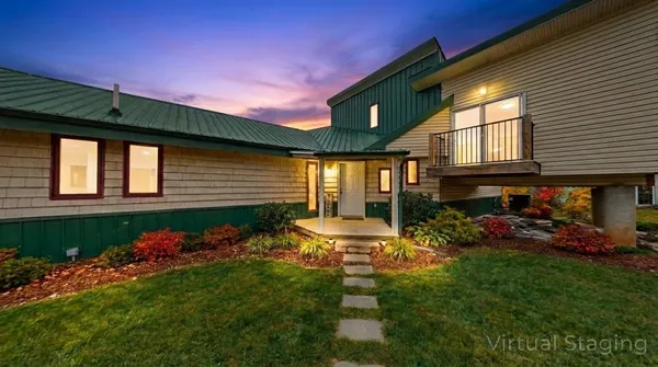 a living room with furniture and large windows