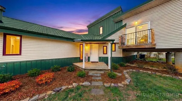 an aerial view of a house with a yard basket ball court and outdoor seating