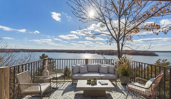 a kitchen with a dining table chairs and white cabinets