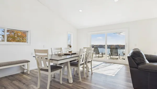 a kitchen with a sink cabinets stainless steel appliances and a window