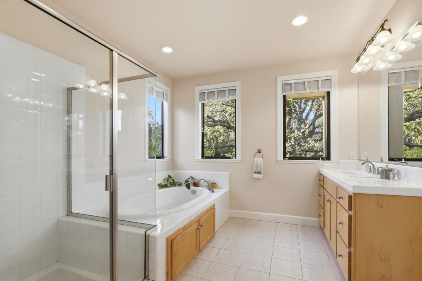 409 Spruce Lane Palo Alto, CA 94306 - Photo 27 of 52 a bathroom with a tub sink and mirror
