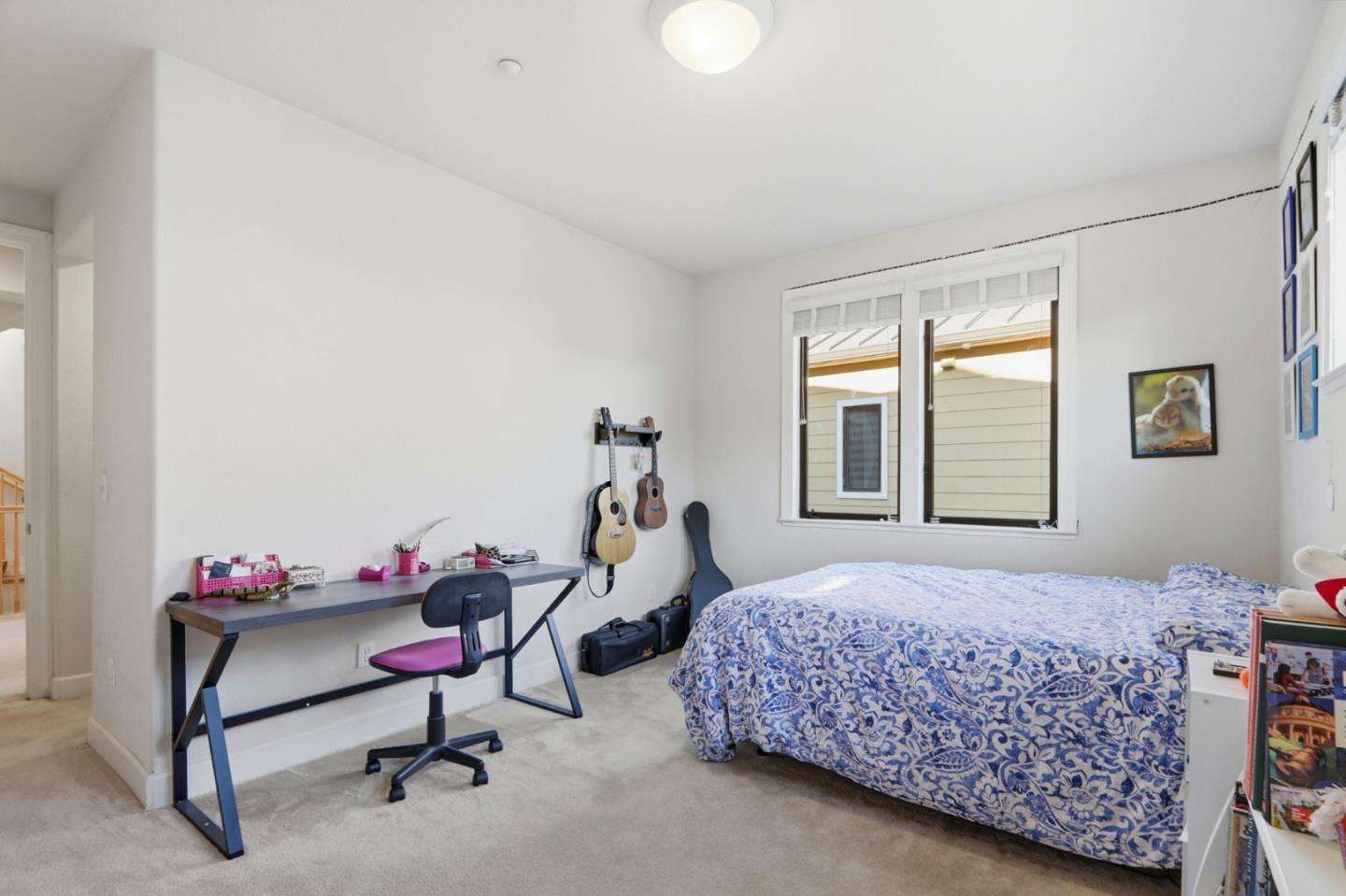 409 Spruce Lane Palo Alto, CA 94306 - Photo 33 of 52 a bedroom with a bed chair and a window