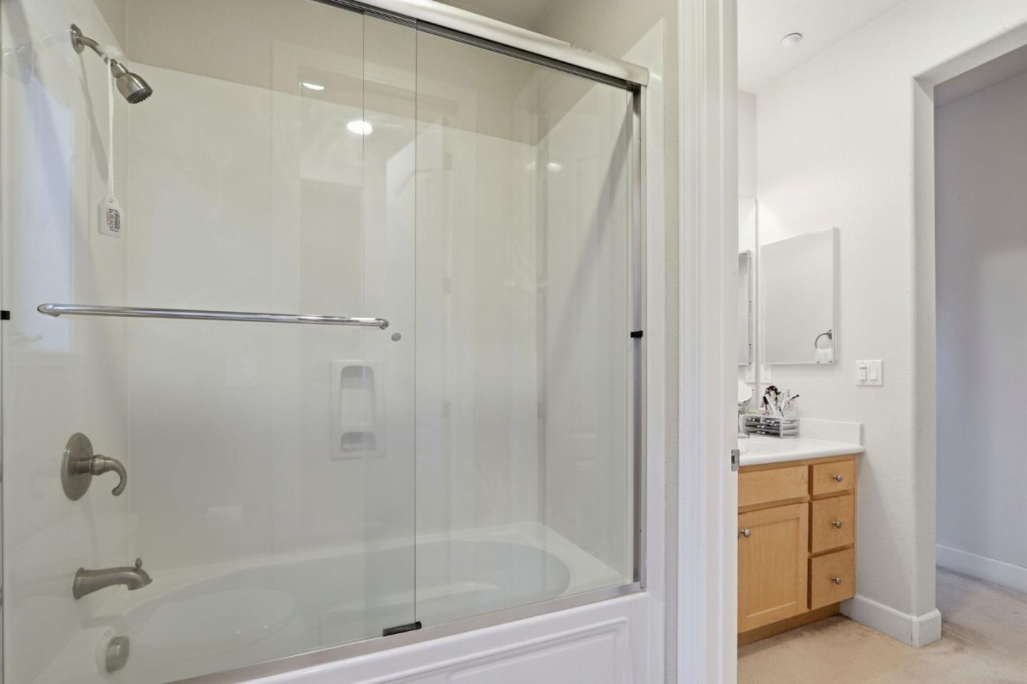 409 Spruce Lane Palo Alto, CA 94306 - Photo 36 of 52 a bathroom with a bathtub and a shower