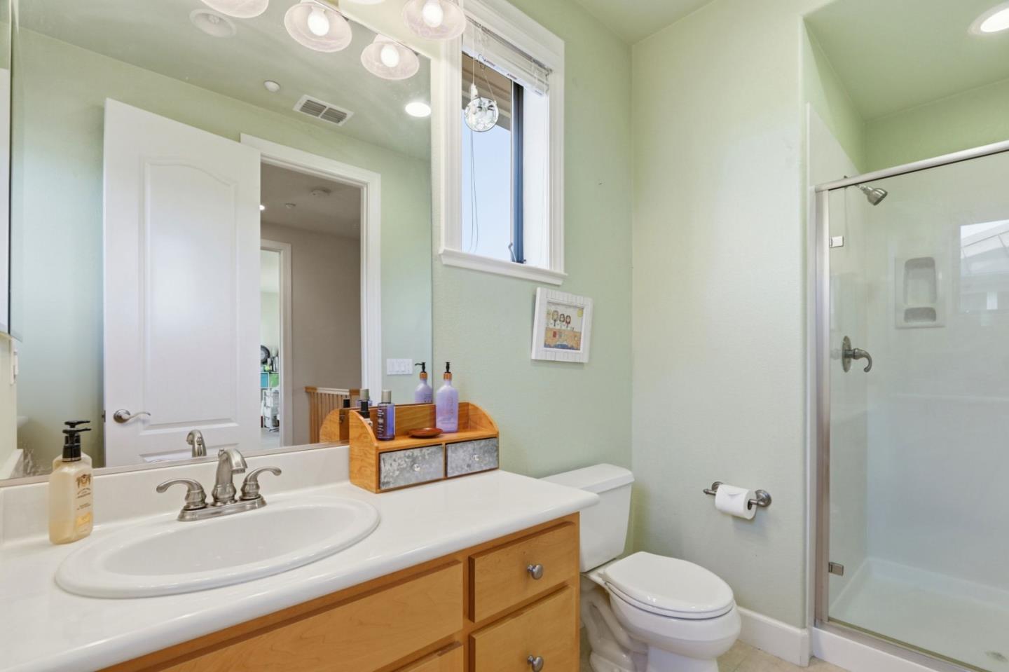 409 Spruce Lane Palo Alto, CA 94306 - Photo 41 of 52 a bathroom with a sink vanity mirror and toilet