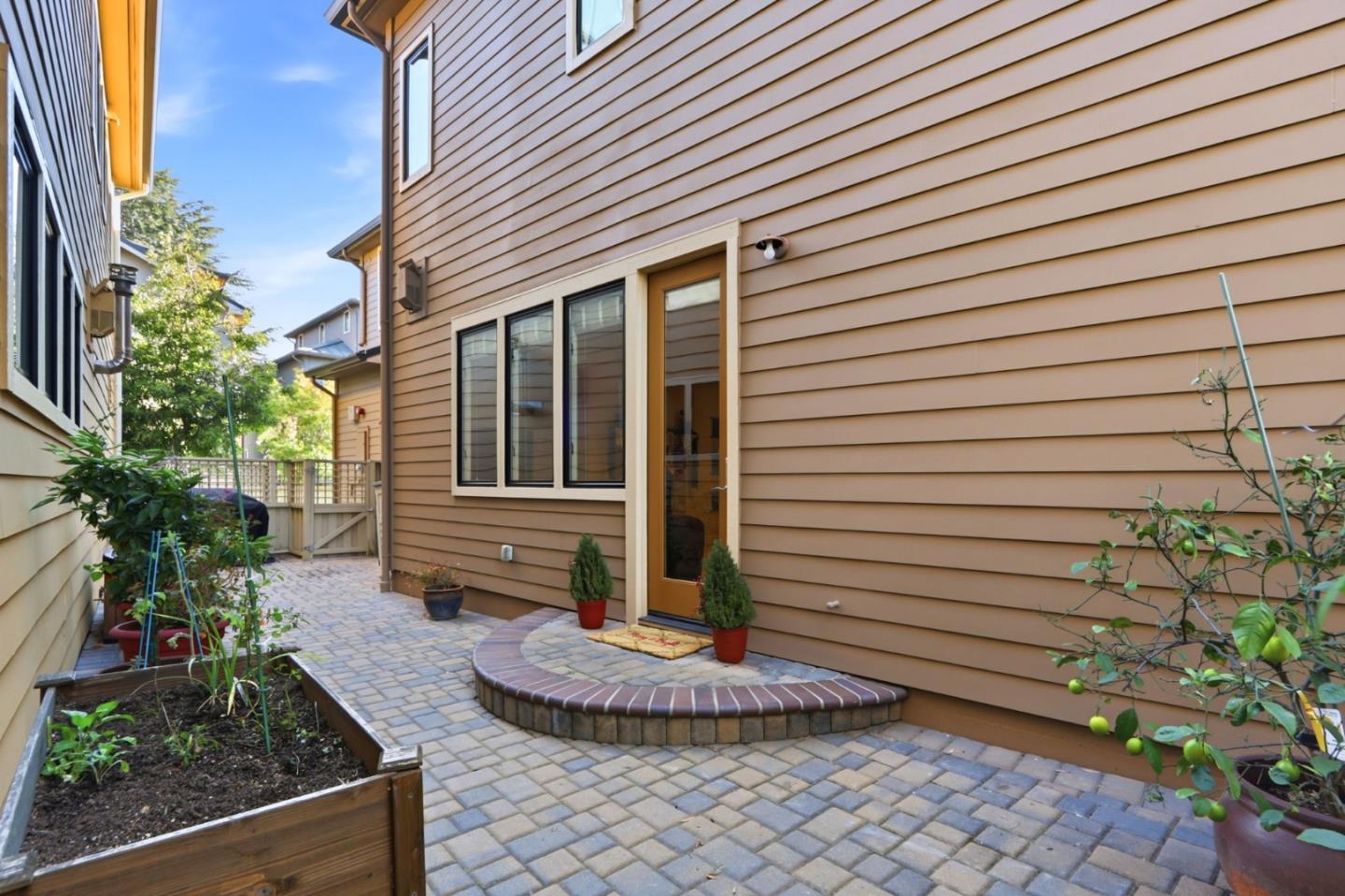 409 Spruce Lane Palo Alto, CA 94306 - Photo 43 of 52 a front view of a house with garden