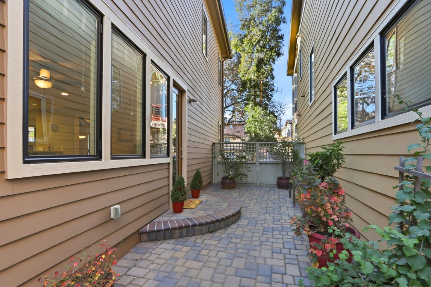 409 Spruce Lane Palo Alto, CA 94306 - Photo 44 of 52 a backyard of a house with outdoor seating