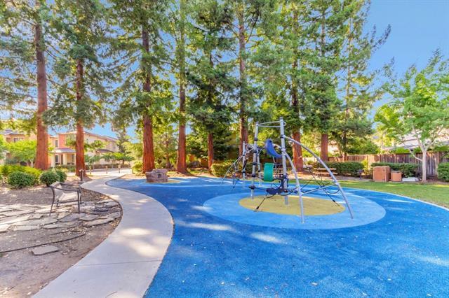 409 Spruce Lane Palo Alto, CA 94306 - Photo 49 of 52 a view of a swimming pool with an outdoor space and seating area