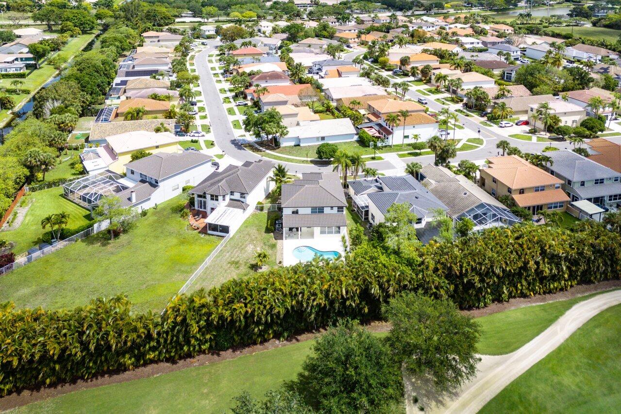 11157 Harbour Springs Circle Boca Raton, FL 33428 - Photo 44 of 68 an aerial view of residential houses with outdoor space and trees all around