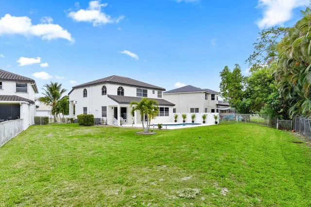 a house view with a garden space and entertaining space