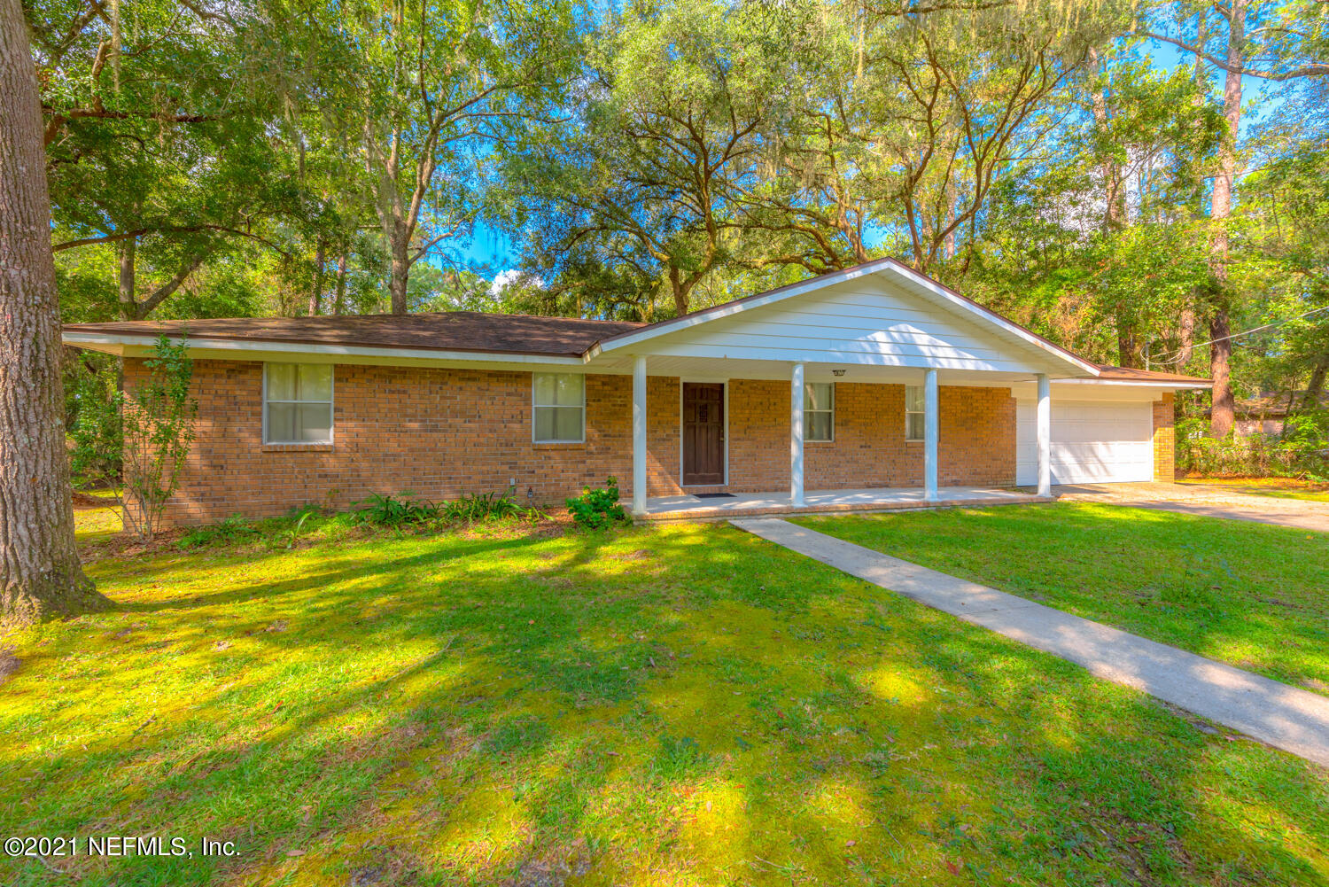540259 Lem Turner Road Callahan, FL 32011 - Photo 1 of 40 a front view of a house with a yard