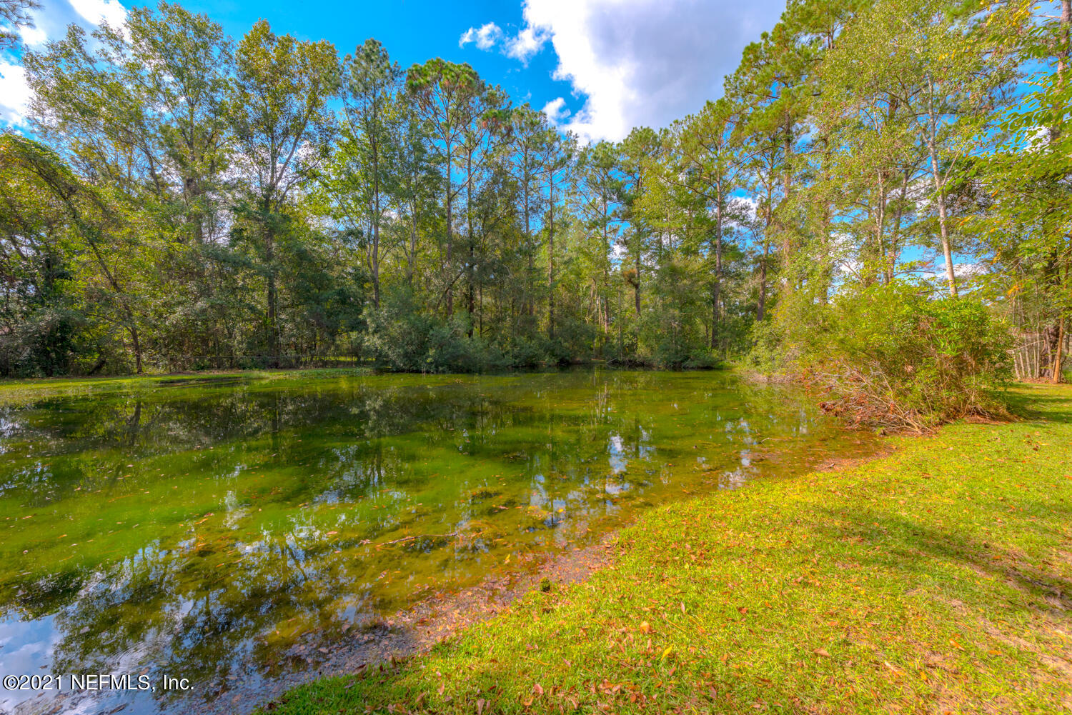 540259 Lem Turner Road Callahan, FL 32011 - Photo 28 of 40 a view of a lake with a yard