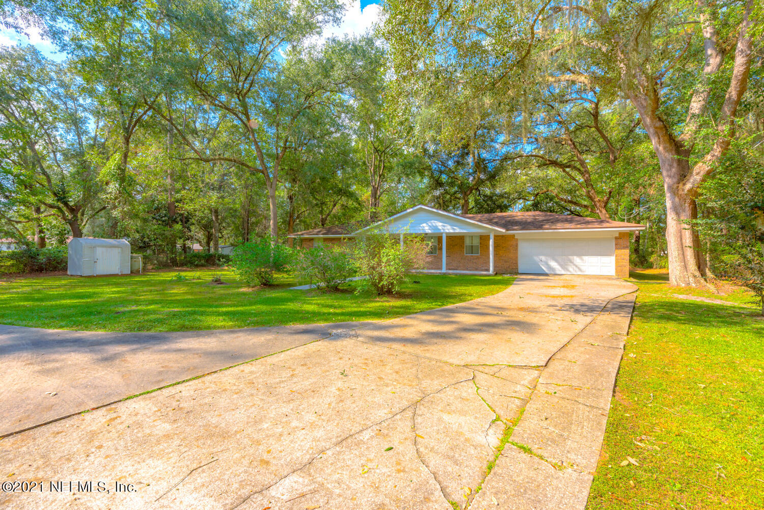540259 Lem Turner Road Callahan, FL 32011 - Photo 3 of 40 a front view of a house with yard and green space