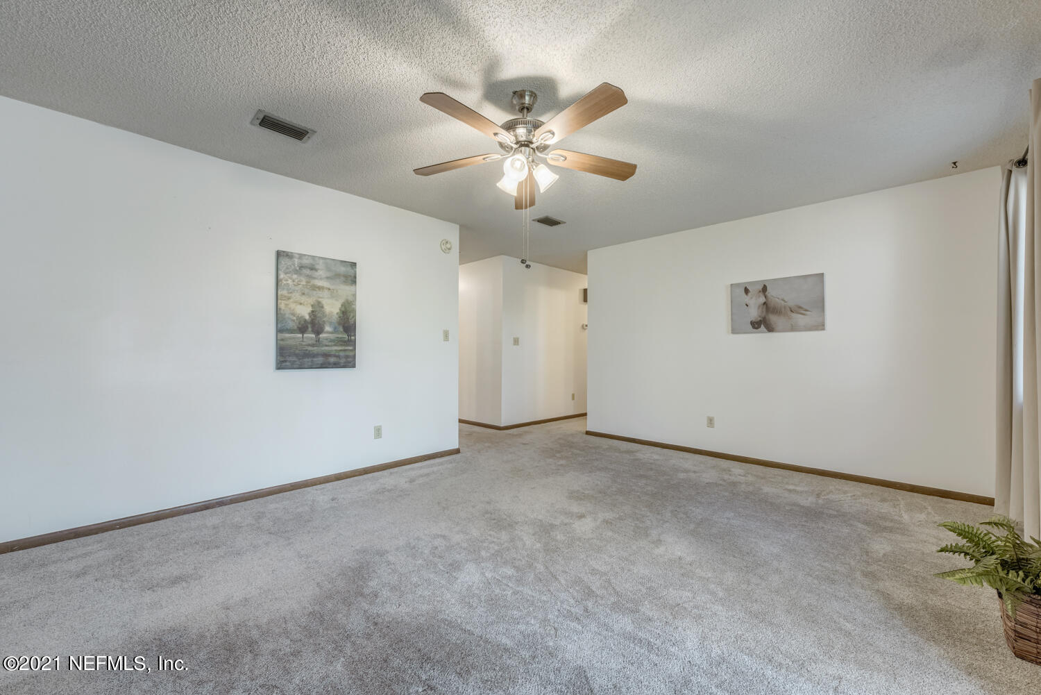 540259 Lem Turner Road Callahan, FL 32011 - Photo 8 of 40 a view of an empty room with a ceiling fan