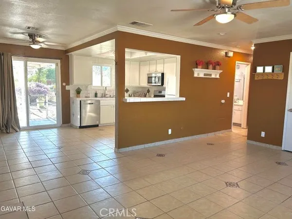 a view of a livingroom with furniture and an entryway