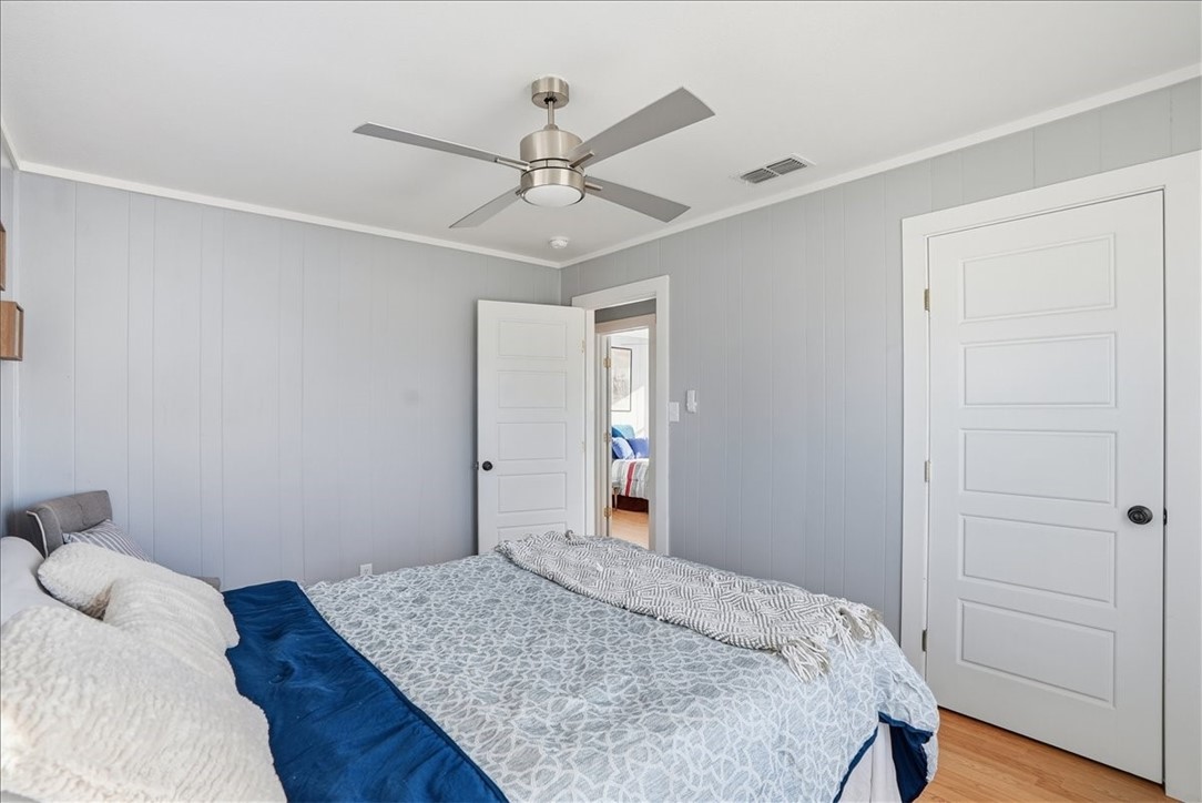 300 Nayer Street Alice, TX 78332 - Photo 18 of 22 a bedroom with a bed and wooden floor