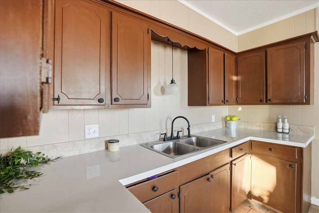 300 Nayer Street Alice, TX 78332 - Photo 6 of 22 a kitchen with stainless steel appliances a sink a refrigerator and cabinets