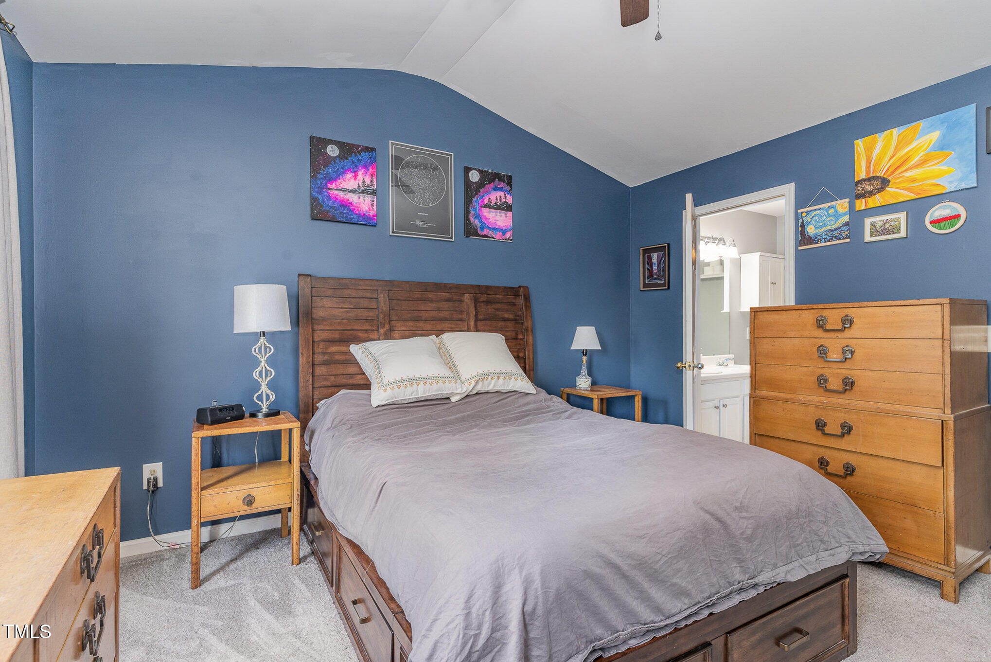 1812 Natalie Brook Way Raleigh, NC 27609 - Photo 16 of 31 a bedroom with a bed and wooden floor